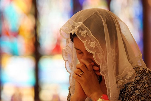 Woman in prayer.