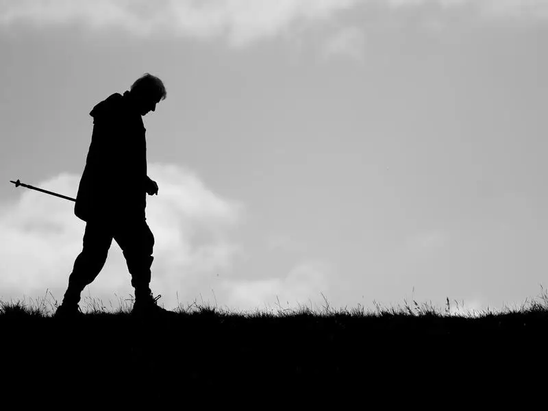 Silhouette of a man walking