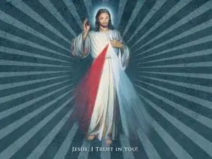 An illustration of Jesus with rays of red and white light shining from his heart, standing on a blue background with radiating lines. The text below reads, JESUS, I TRUST IN YOU!.