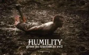 Man on stomach in mud and covered with mud