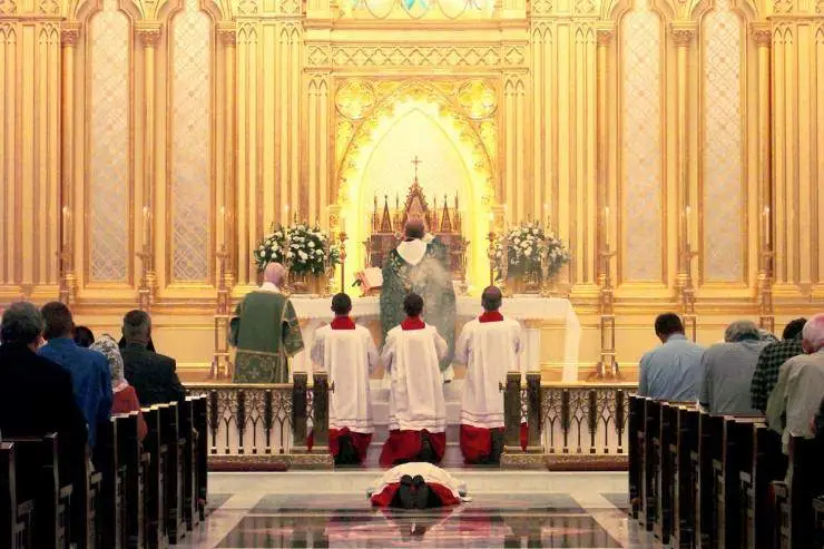 Knights of the Holy Eucharist in adoration during the Consecration at Mass