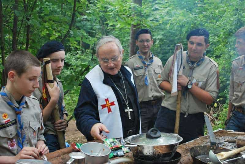 scouts and a priest in the woods