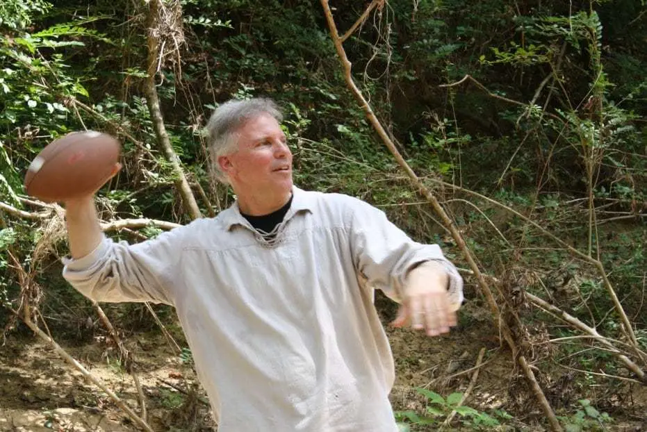 Br. David throwing a football during recreation