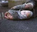 feet covered with thread-barren socks