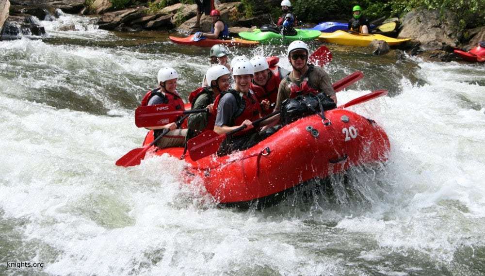 people recreating in a raft