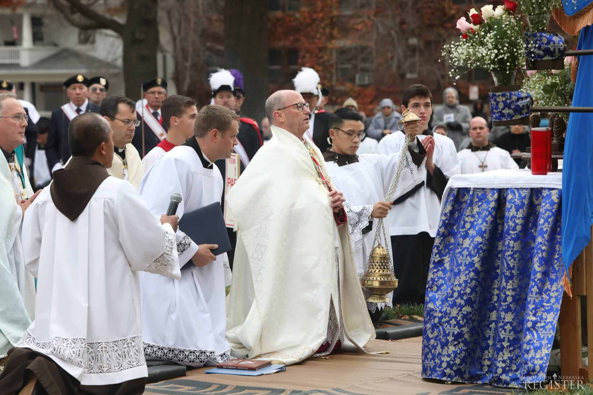 Bishop Conley and servers at Benediction during Eucharistic procession