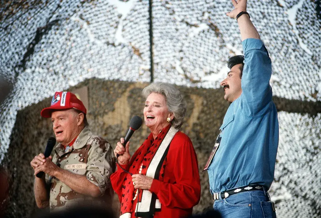 Bob and Dolores Hope perform for U.S. troops at a USO Christmas show during Operation Desert Shield, December 1990