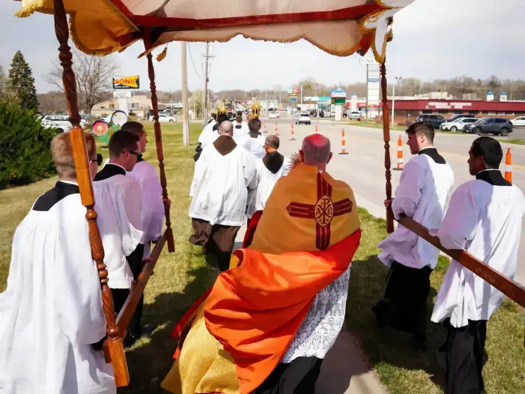 Knights of the Holy Eucharist taking part in a Eucharistic procession